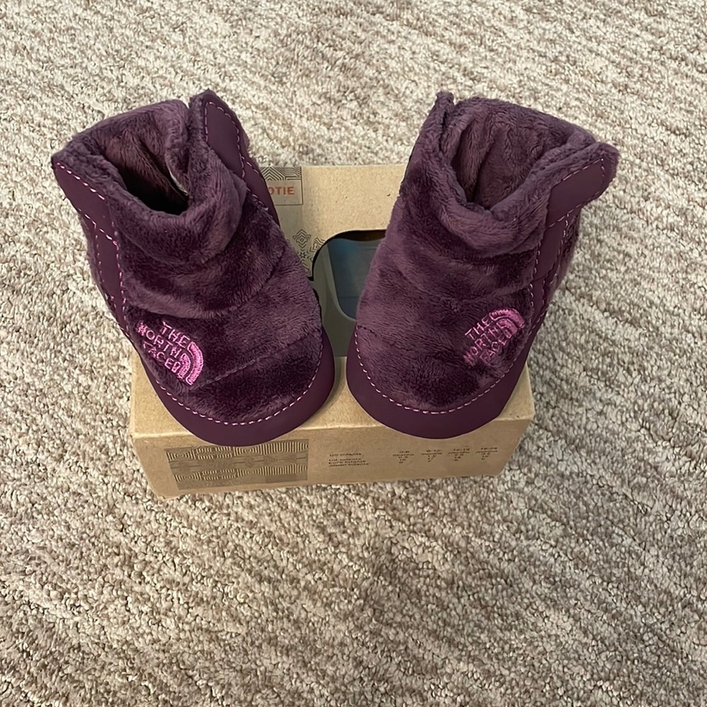 North face baby booties. 12-18 months. With box. Looks brand new.